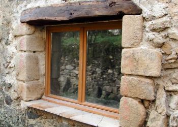 window with reclaimed carved stones by B3KM EcoDesign